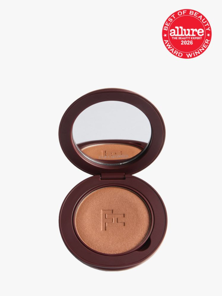 Brown container of Fara Homidi Essential Bronzer Compact with a mirror with Allure Best of Beauty stamp in top right corner on a light gray background