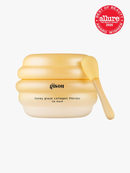 Yellow container of Gisou Honey Glaze Collagen Therapy Lip Mask on light gray background