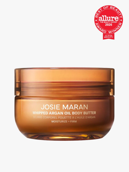 Josie Maran Whipped Argan Oil Body Butter in branded component on a light gray background with the 2026 best of beauty seal in the top right corner